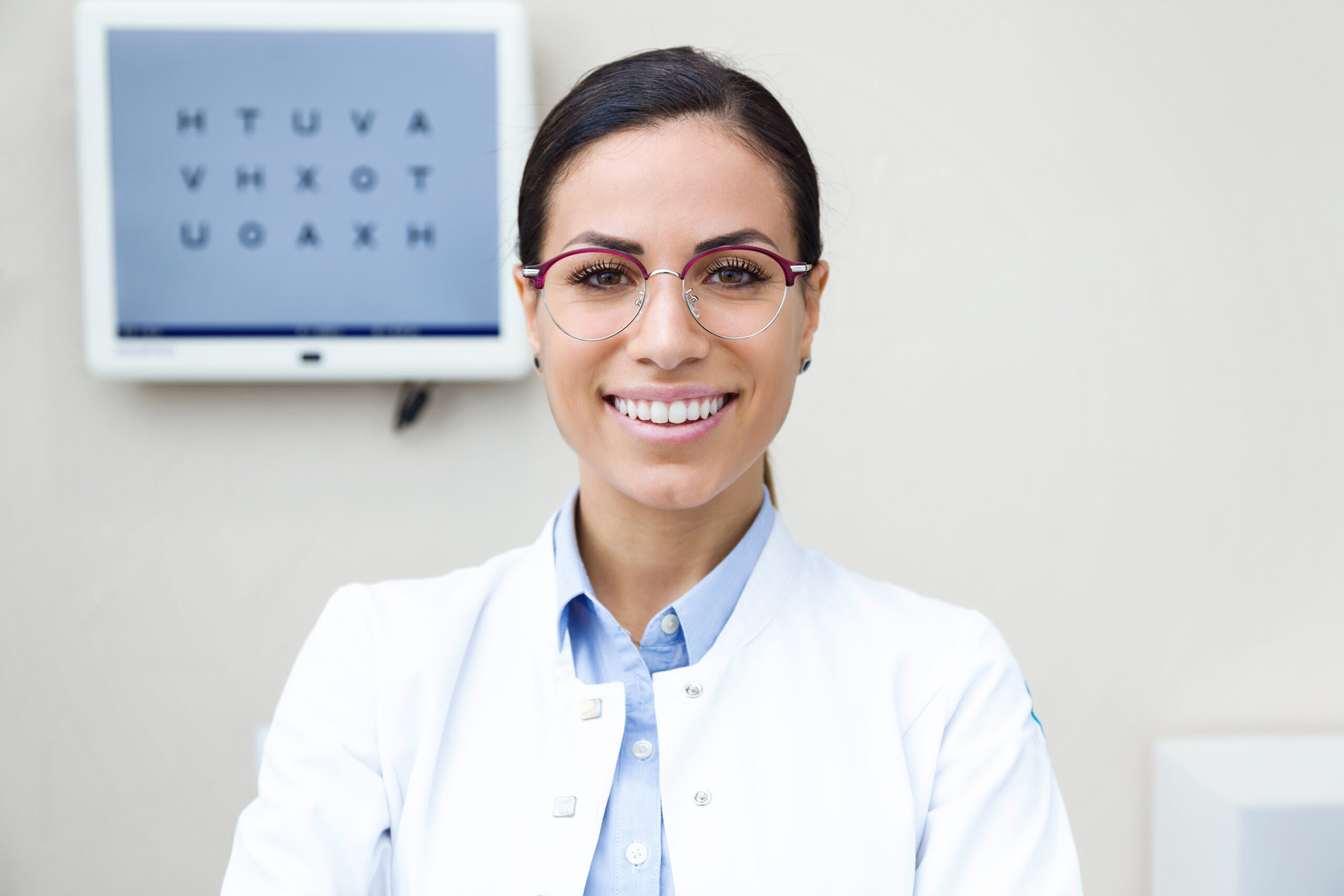 Optometrist, A fulfilled optometrist, optometrist smiling at the camera